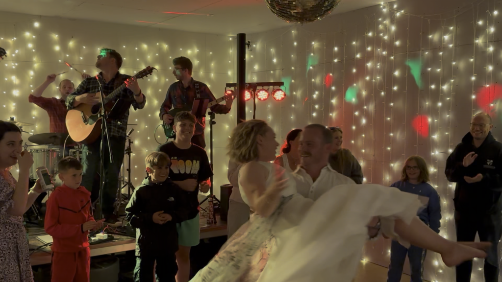 The band play while the groom spins with the bride!